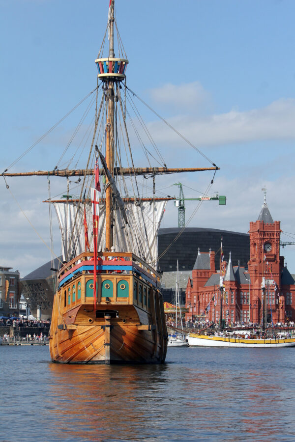 A boat with the Pierhead Building in the background