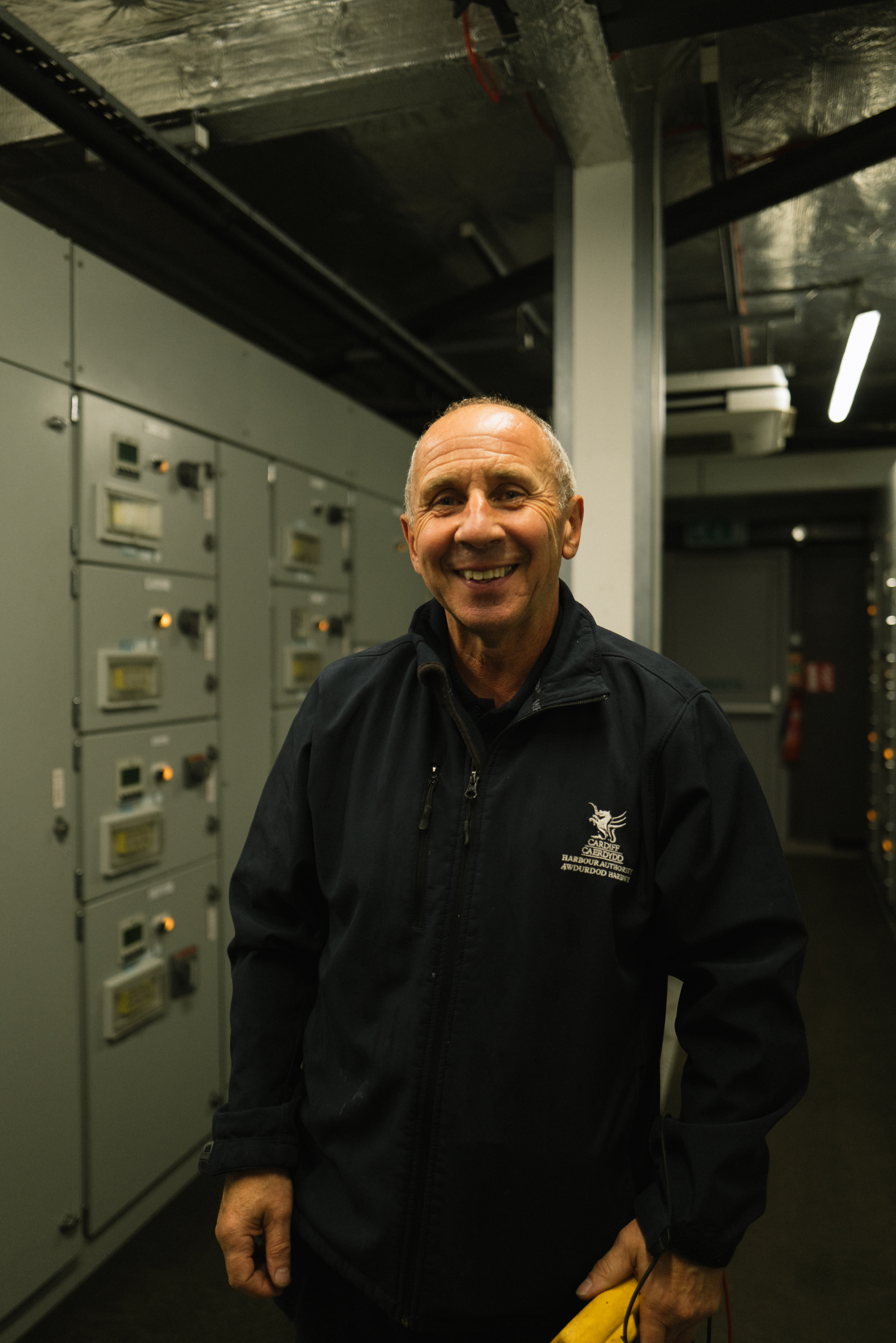 A person stood in voltage switch room.