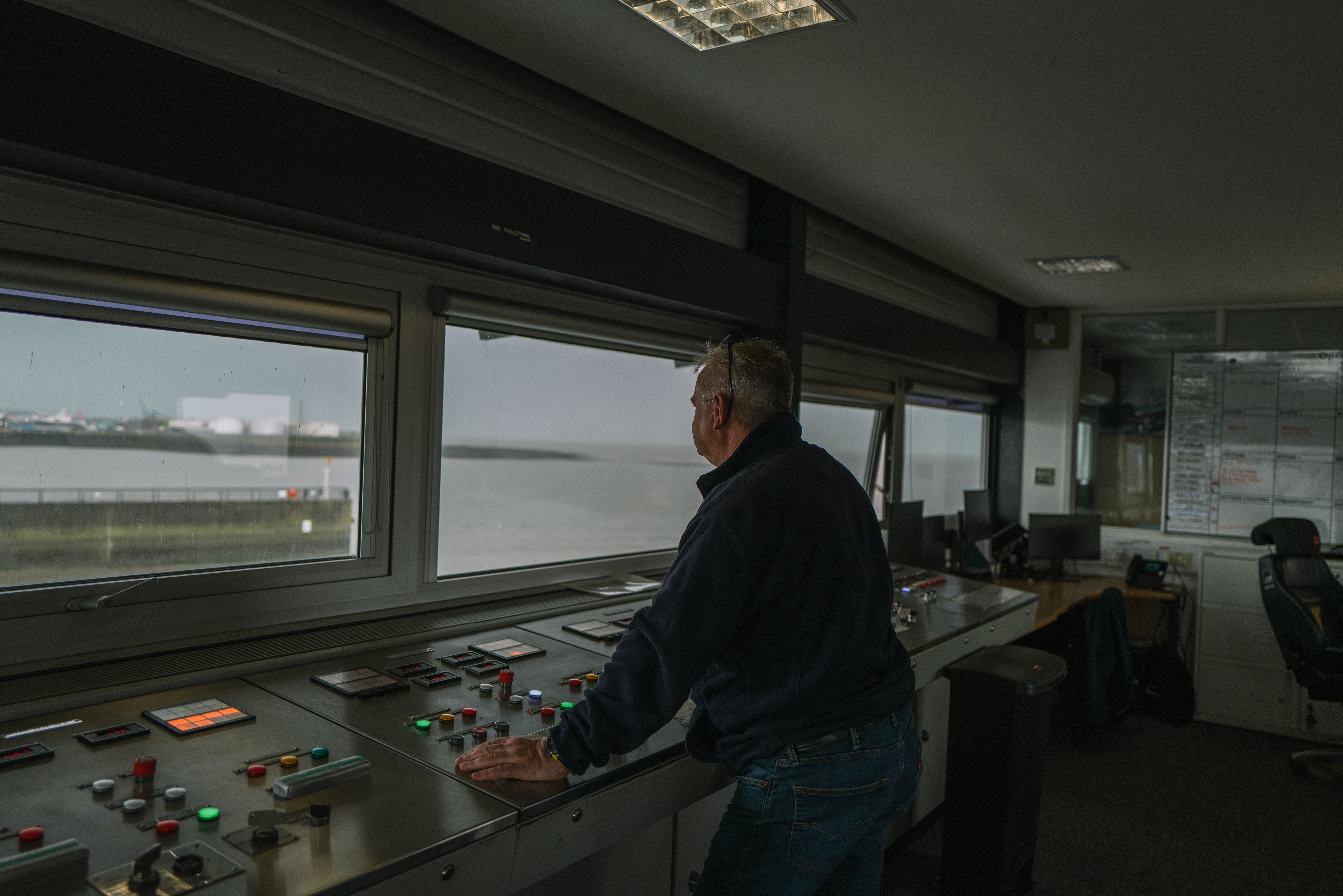 Person looking out to Barrage from operational room.