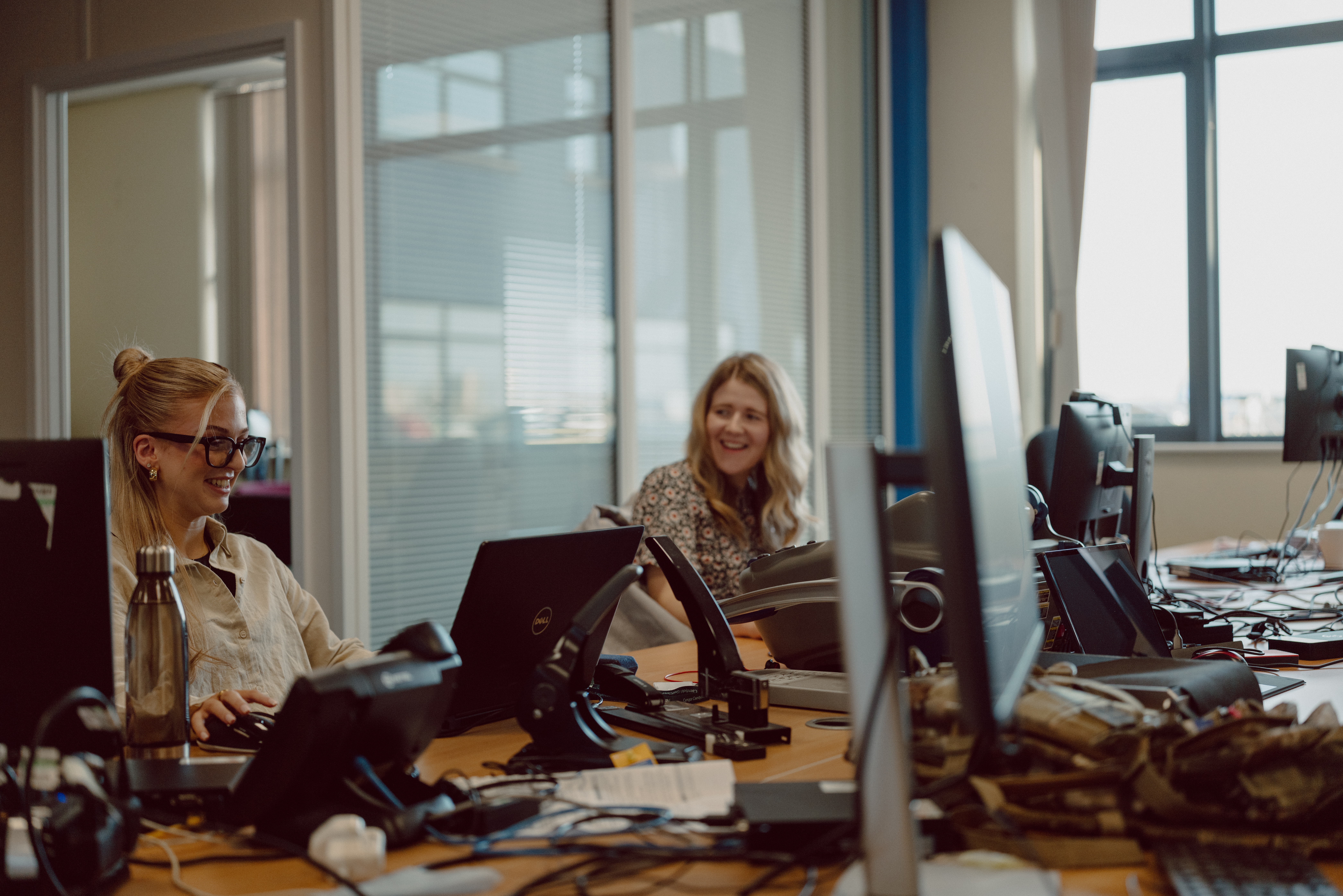Two people at computers.